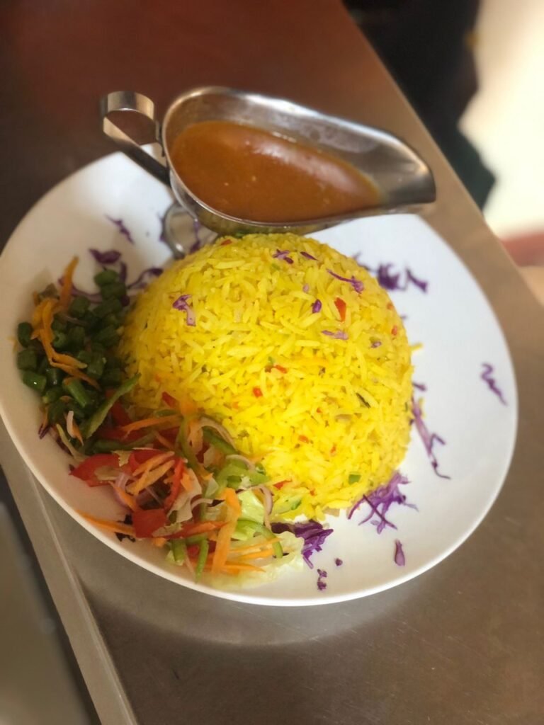 A plate of vegetable rice, a colorful and appetizing dish, part of the menu offerings at Irman Restaurant and Cafe.